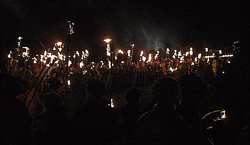 Picture of the villagers armed with flaming torches on bonfire night at Heyshott