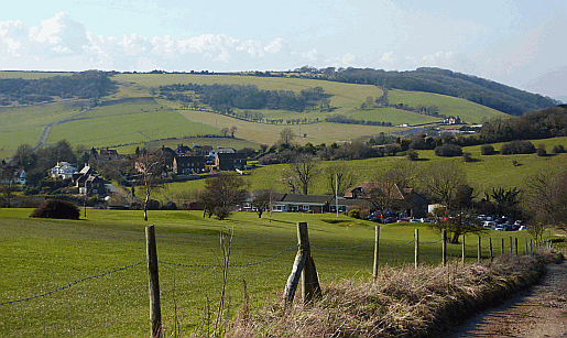 Tjhe South Downs Way follows a narrow path through the middle of the golf course at Pyecombe, West Sussex. Part of our guide to the South Downs Way Picture of the South Downs Way at Pyecombe Golf Club