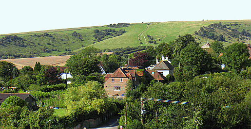 The village of Pycombe in West Sussex Photo of Pycombe with Cow Down, West Hill and the South Downs Way behind it to the South West