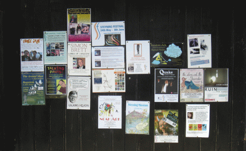 Steyning doorway at Festival time - covered with flyers