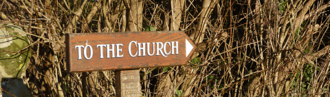 Village church sign at Greatham in West Sussex Picture of a Sussex church sign