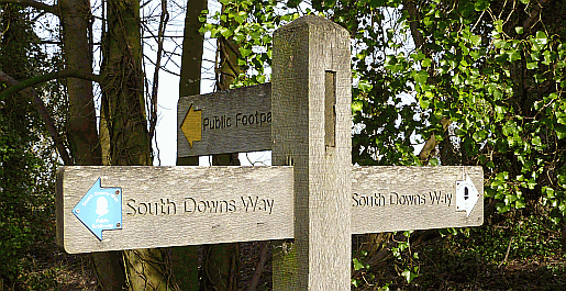 The signpost by Washington Church. Part of our guide to the South Downs Way Picture of South Downs Way signpost at Washington